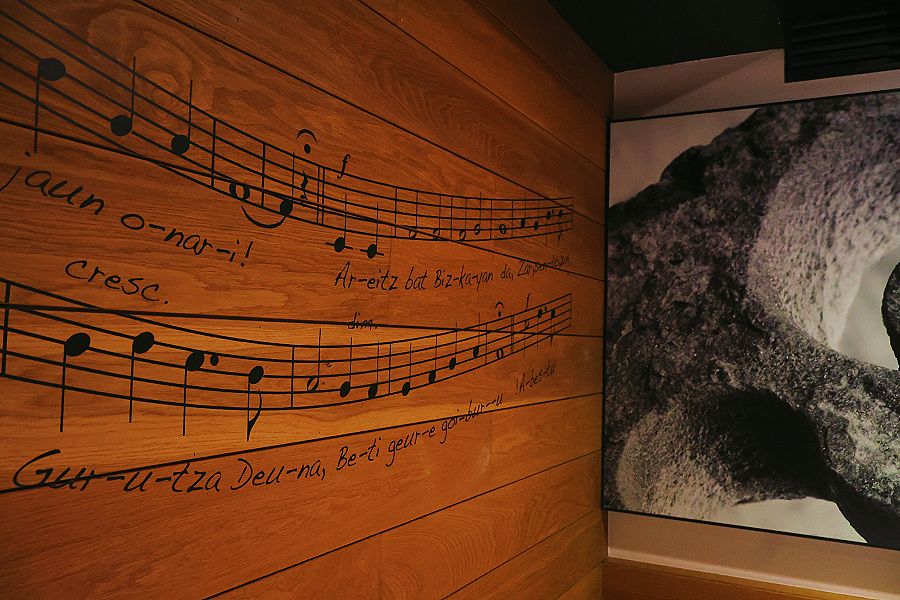 A wooden wall with a handwritten music score